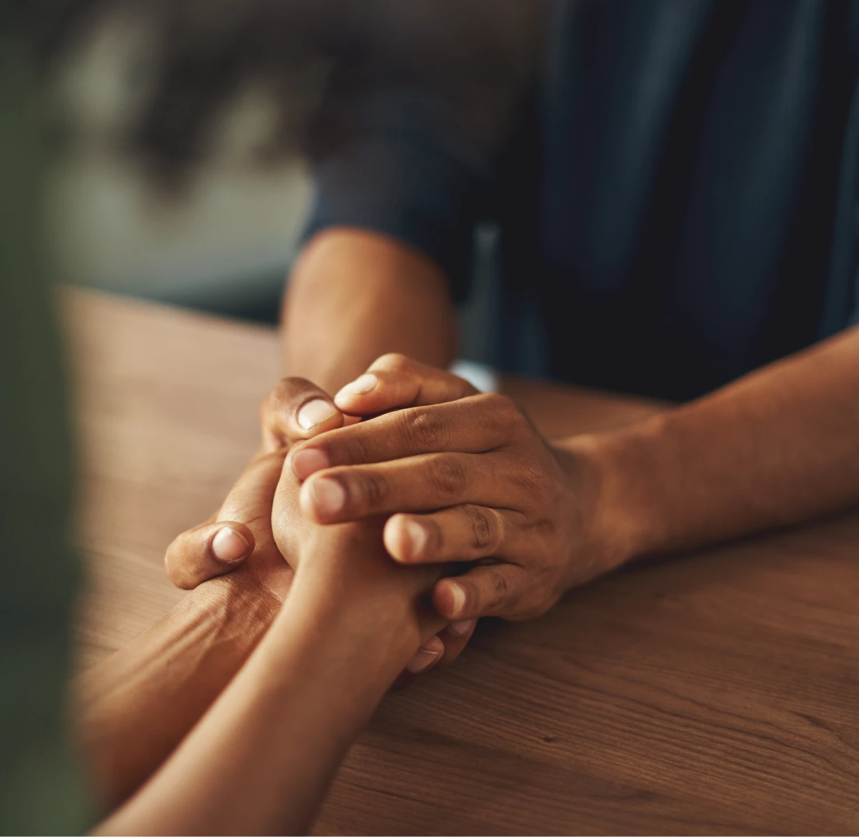 holding hands in a soothing way