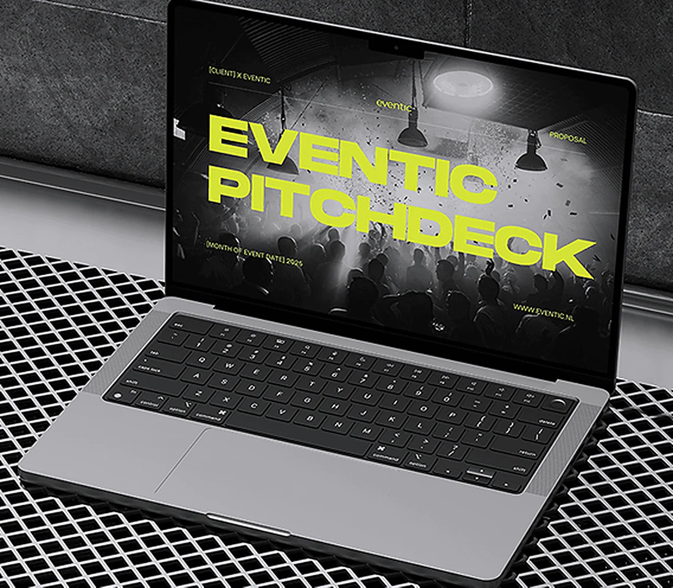 A pitch deck open on a laptop on an industrial metal floor