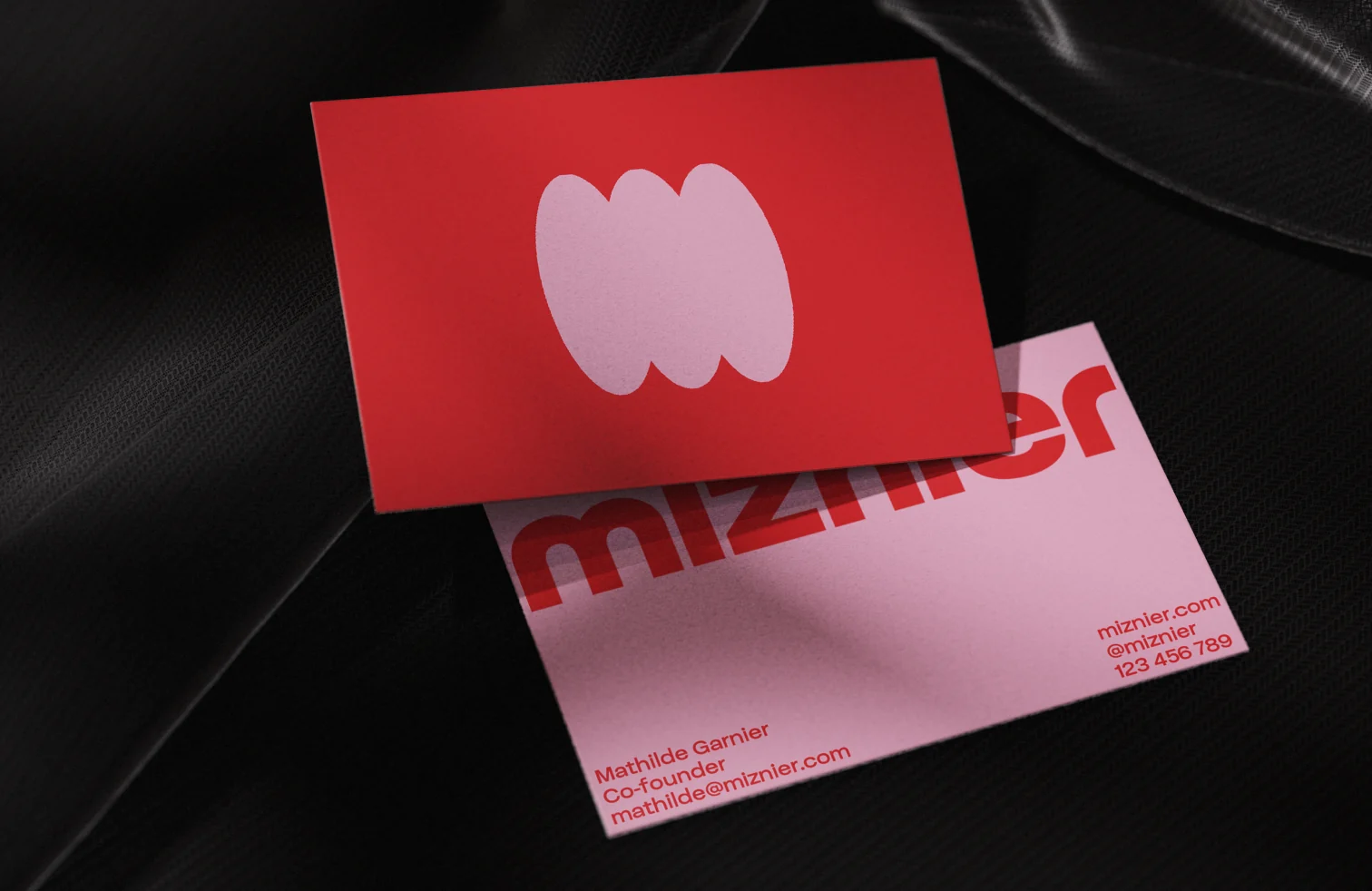 Miznier matcha branding on a red business card