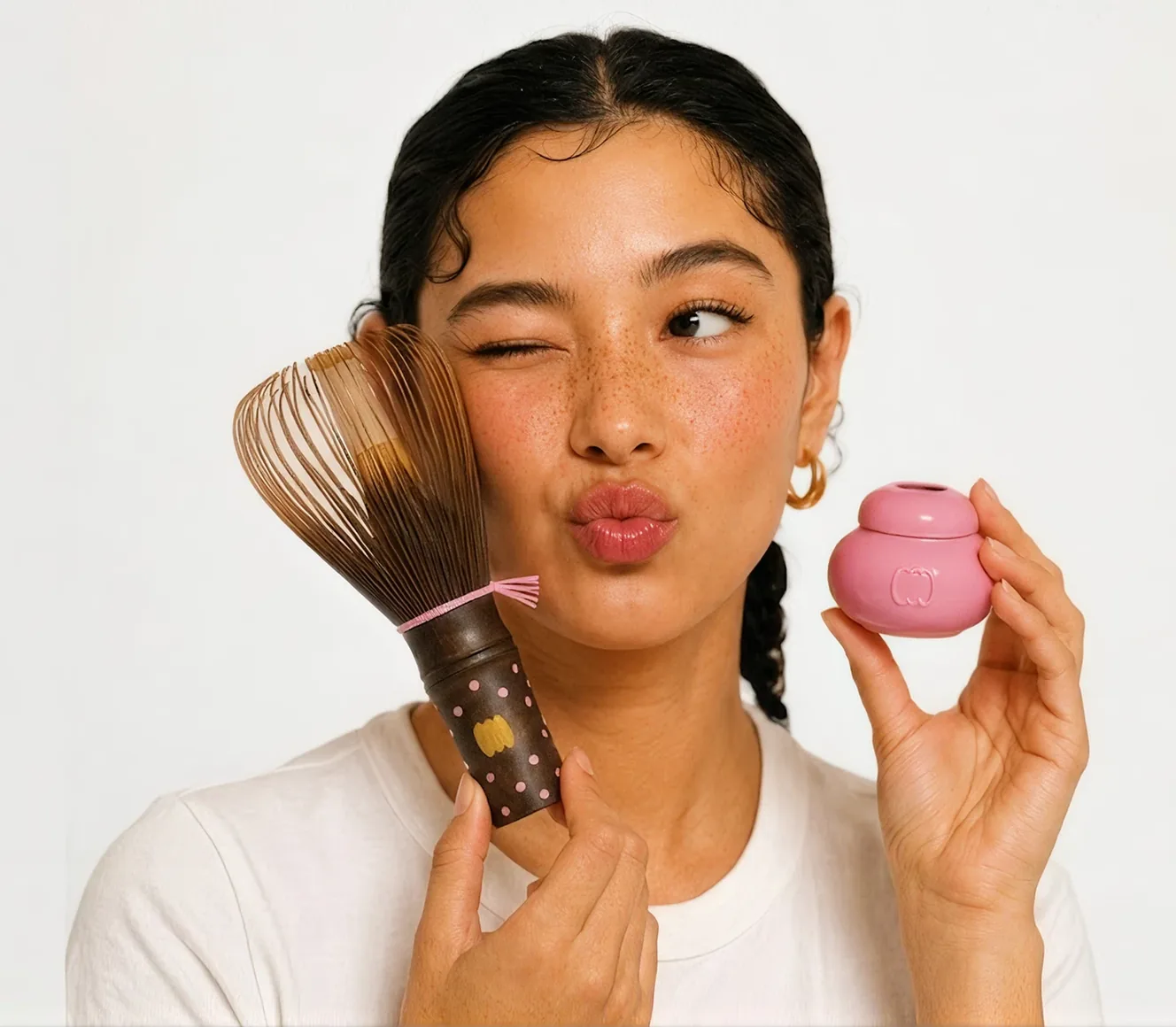A model holding a direct-to-consumer beauty product