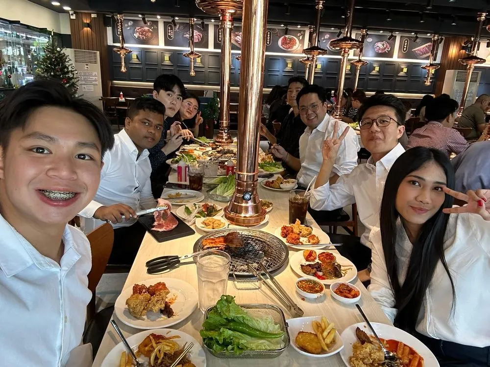 An AIP intern at dinner with his colleagues in Bangkok