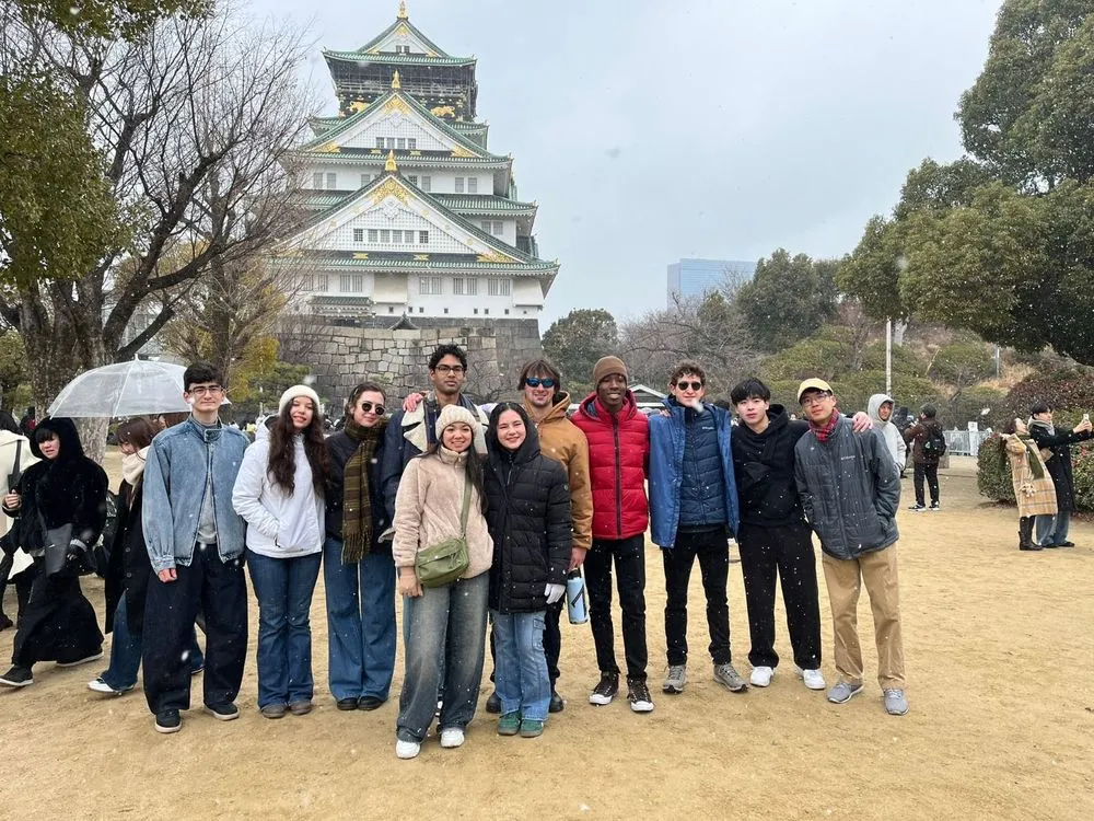 A university student group in front of Osaka Castle