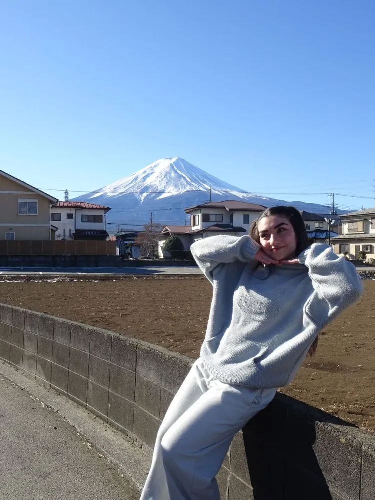 An AIP intern posing in front of Mt Fuji on a day trip
