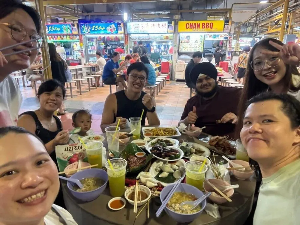 AIP interns sharing dinner at a hawker center in Singapore