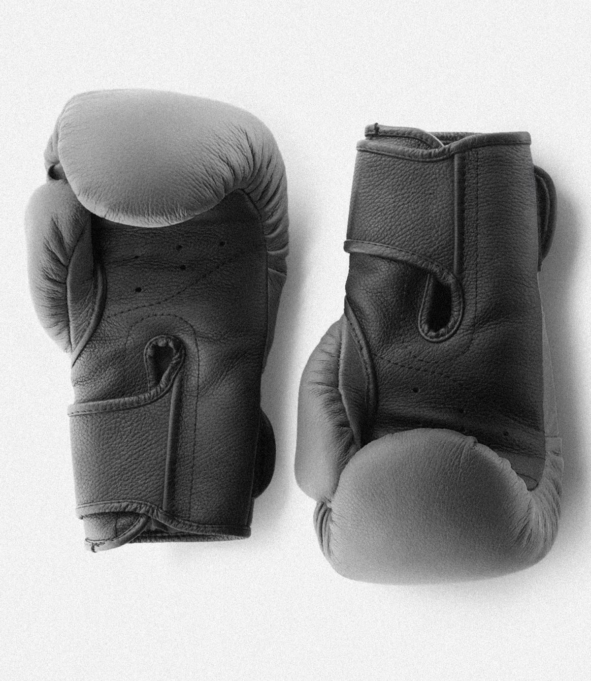 Pair of boxing gloves side by side, in black and white