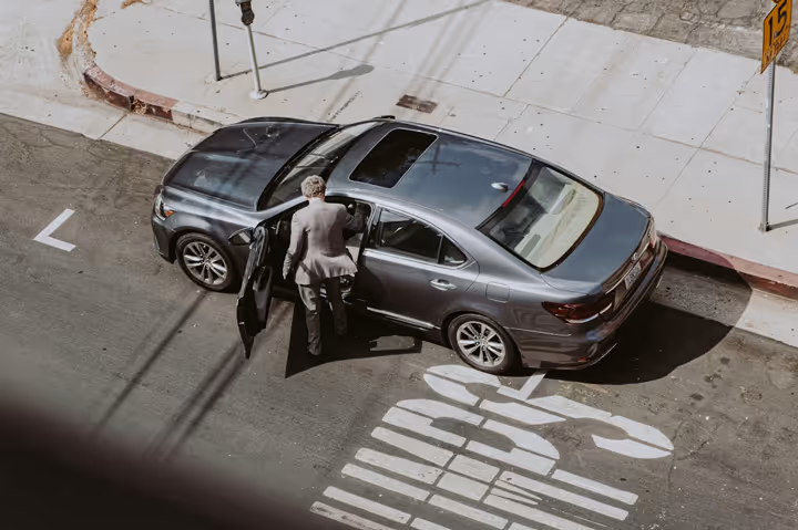 business man entering vehicle