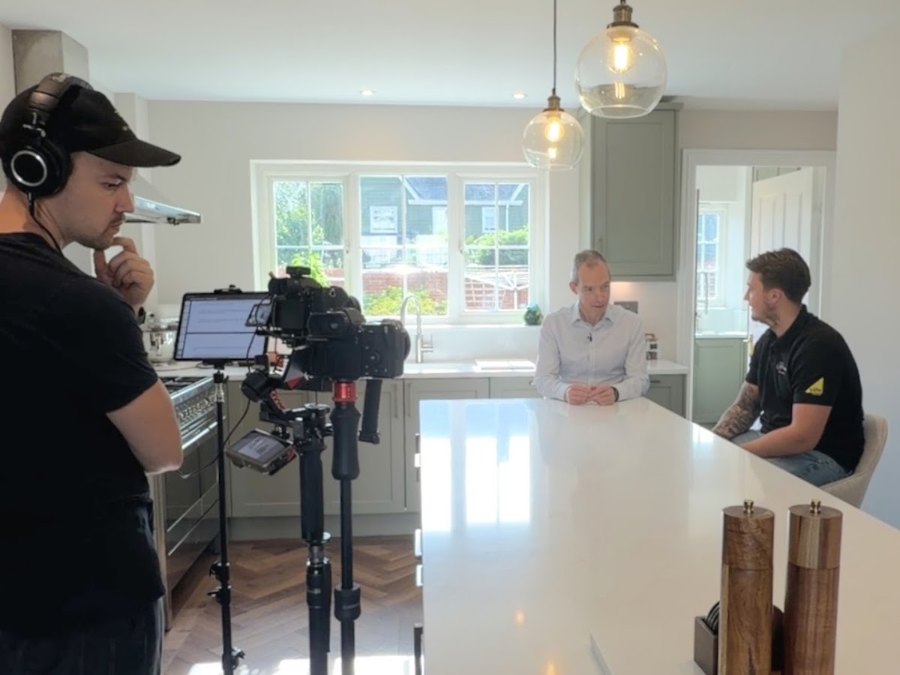 Filming a customer testimonial in a kitchen