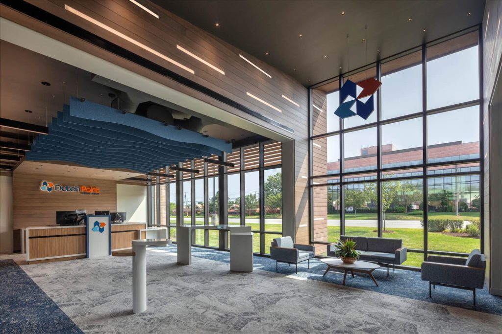 Dutch Point lobby with branded reception wall and hanging logomark