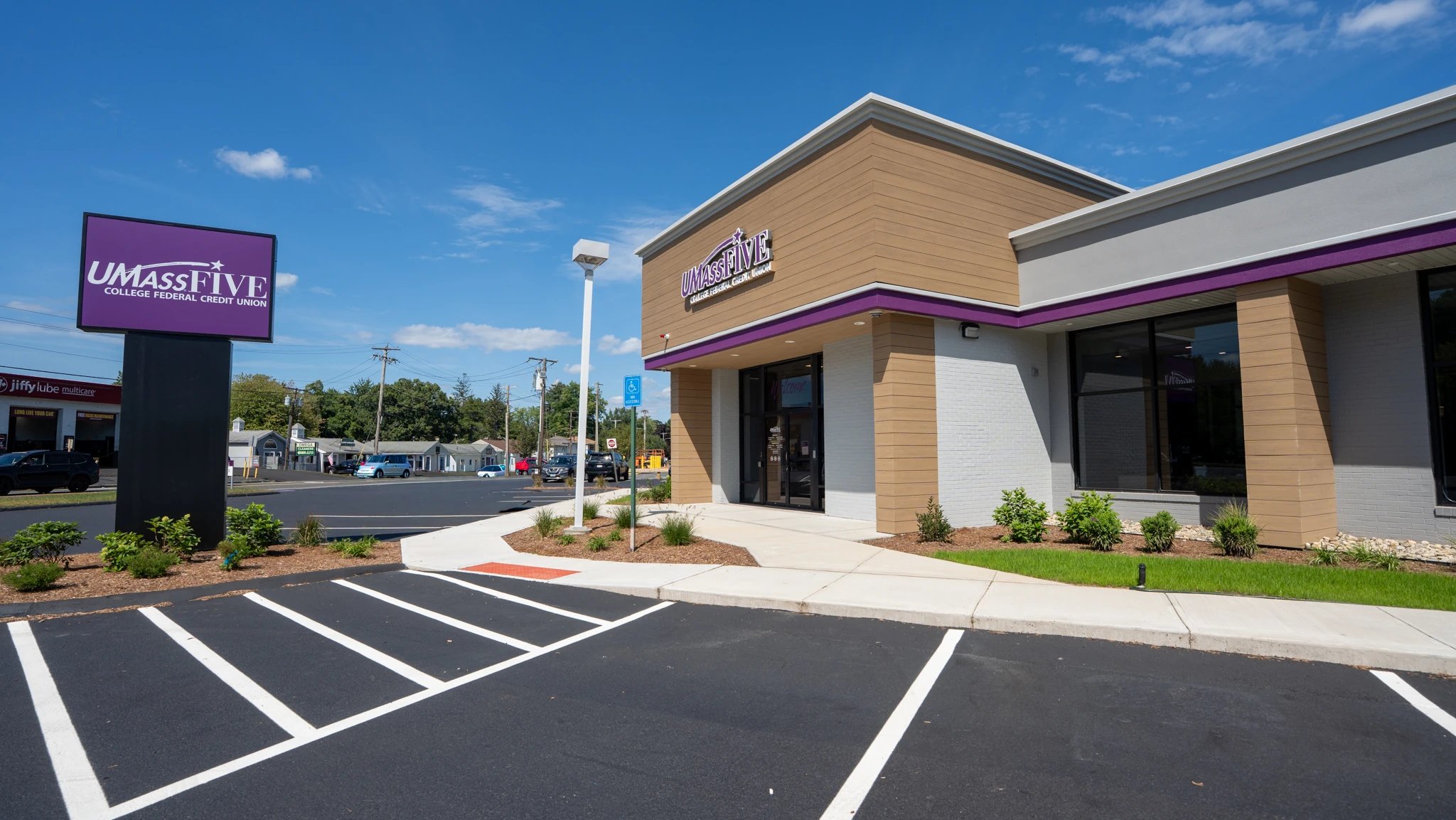 Finished UMassFive Longmeadow branch exterior with monument sign and halo-lit building sign