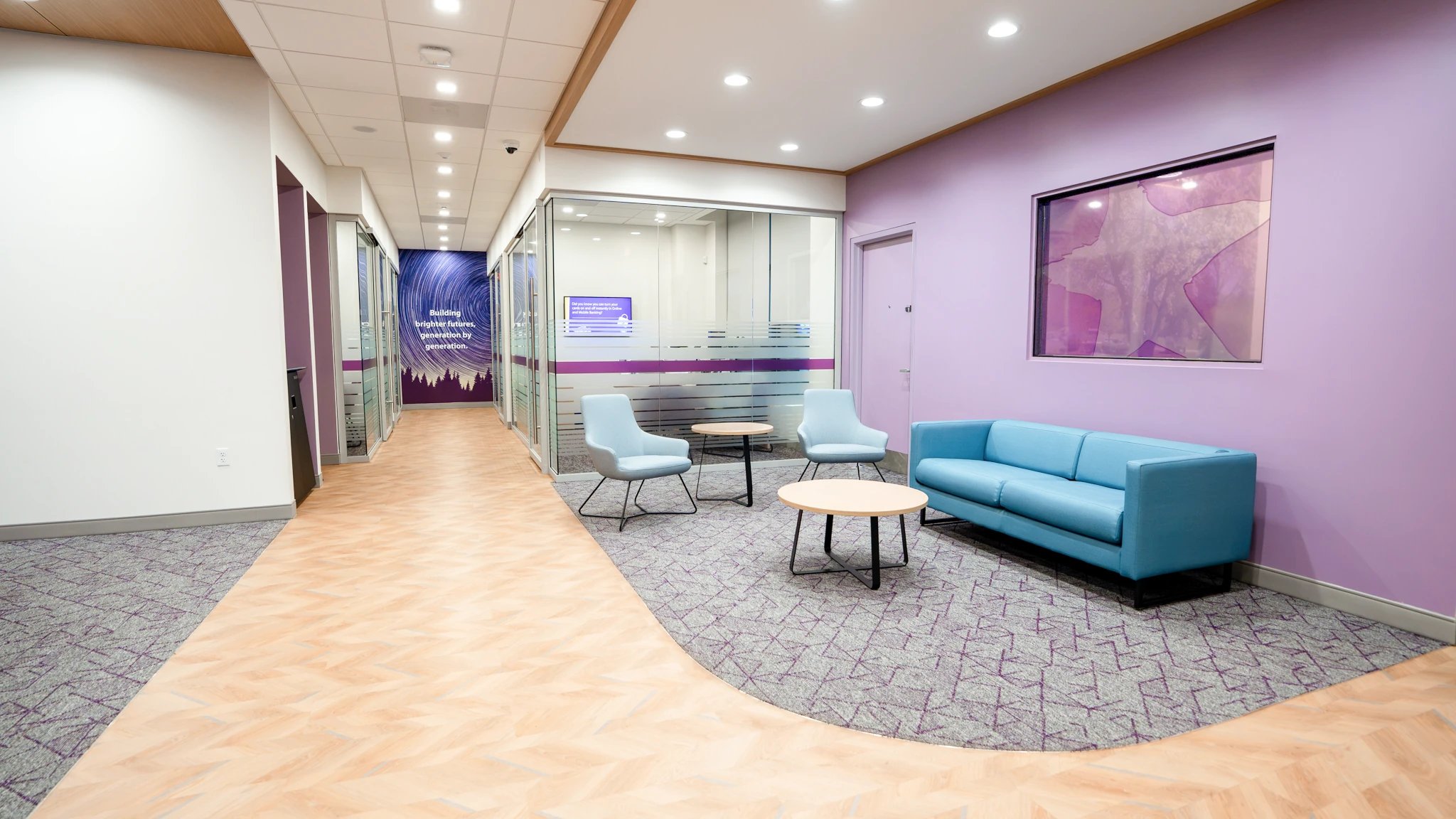 UMassFive lounge and office hallway with privacy vinyl and generation message wall