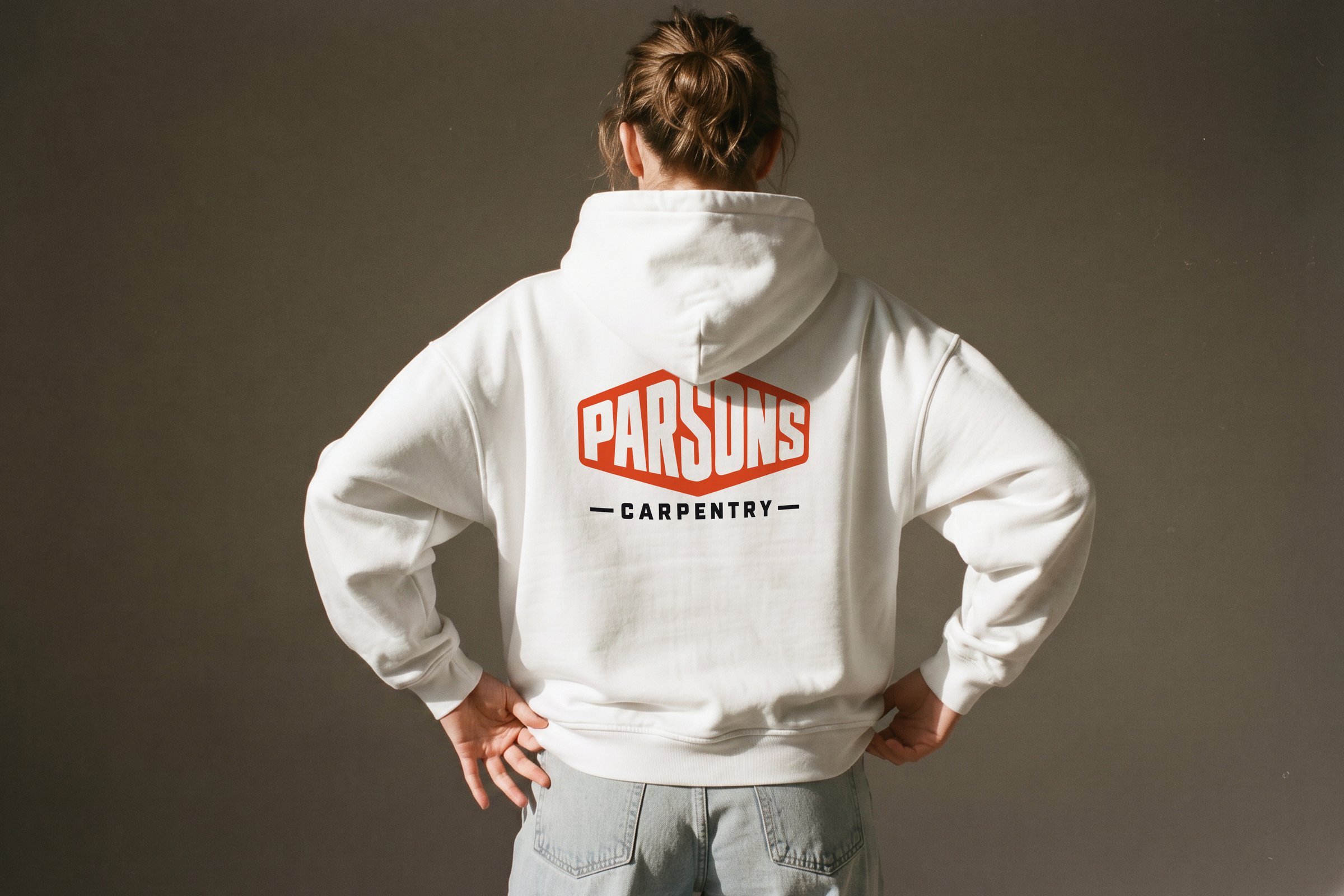 Parsons Carpentry logo on the back of a white hoodie
