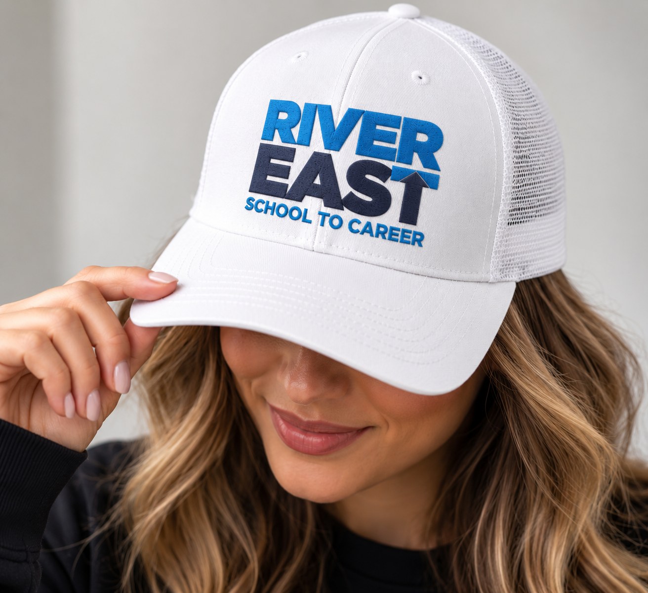 River East School to Career white embroidered trucker hat
