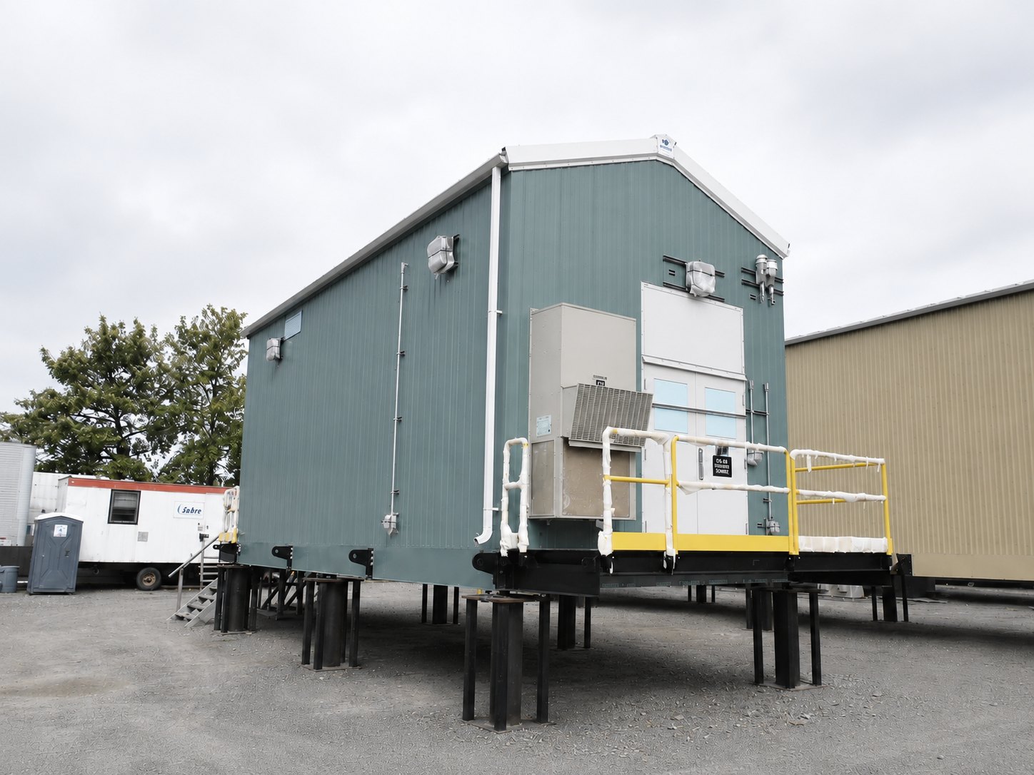 Electrical service building on temporary piers