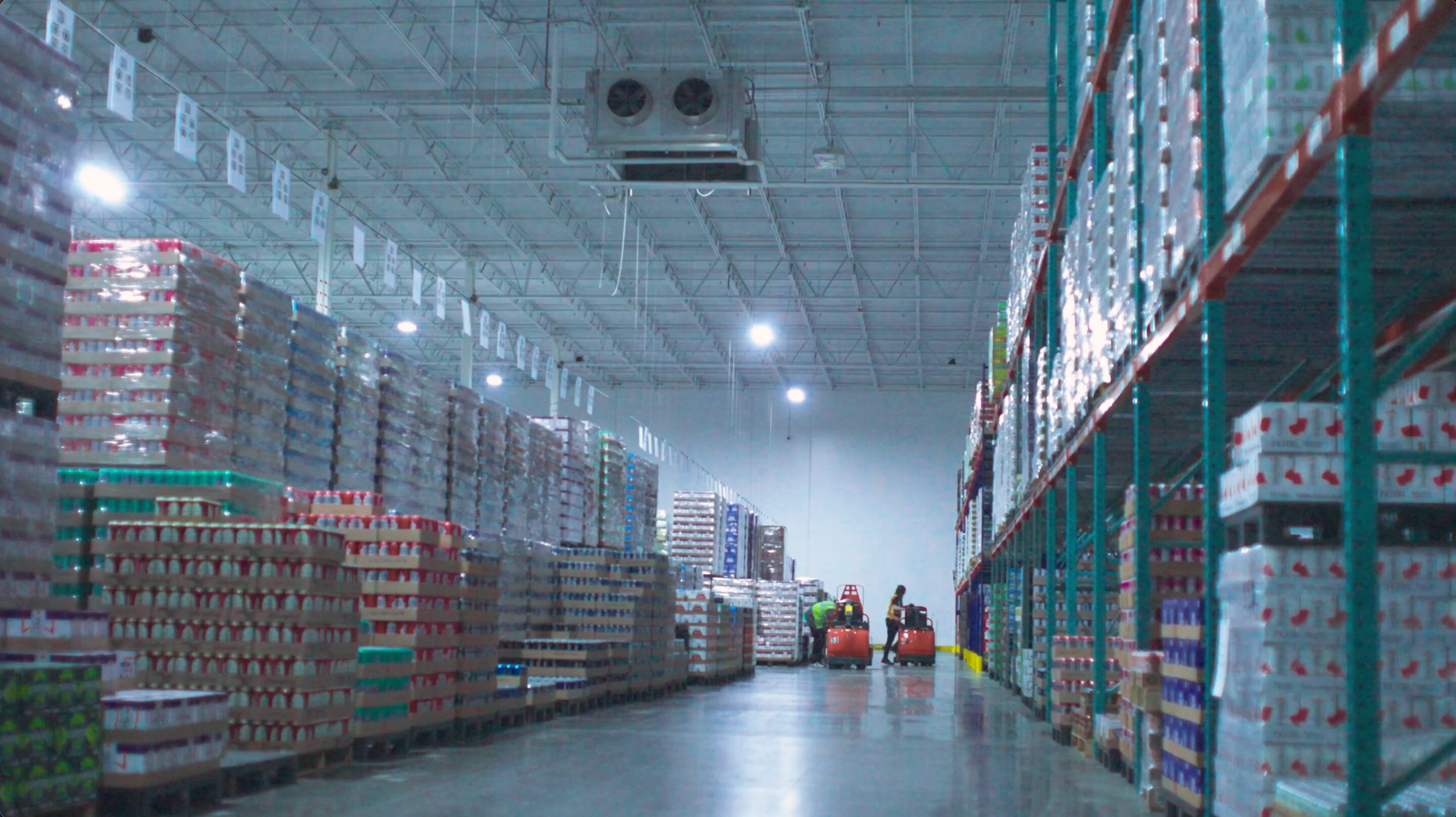 Warehouse aisle stacked with pallets of product