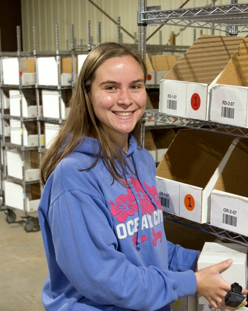 Nora Easteadt, Head of Operations, at work in the EcoShip warehouse