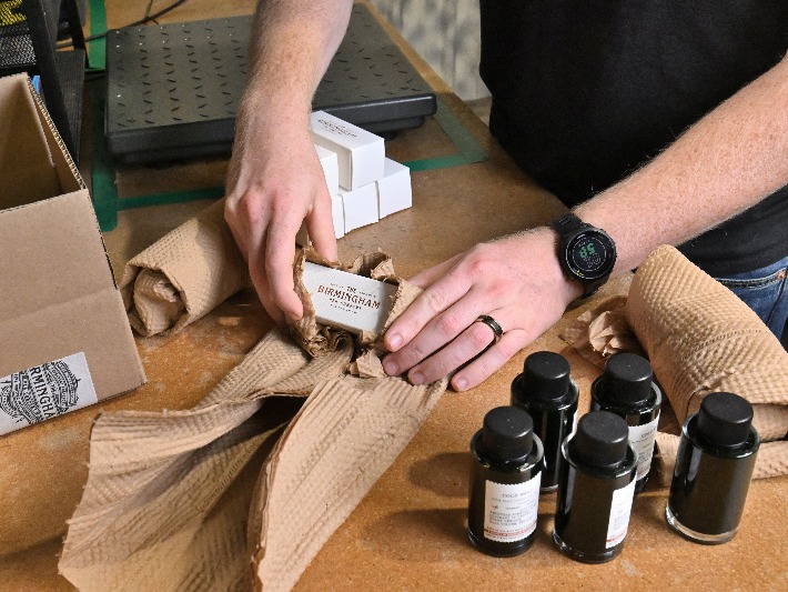 Ink bottle wrapped in wadding