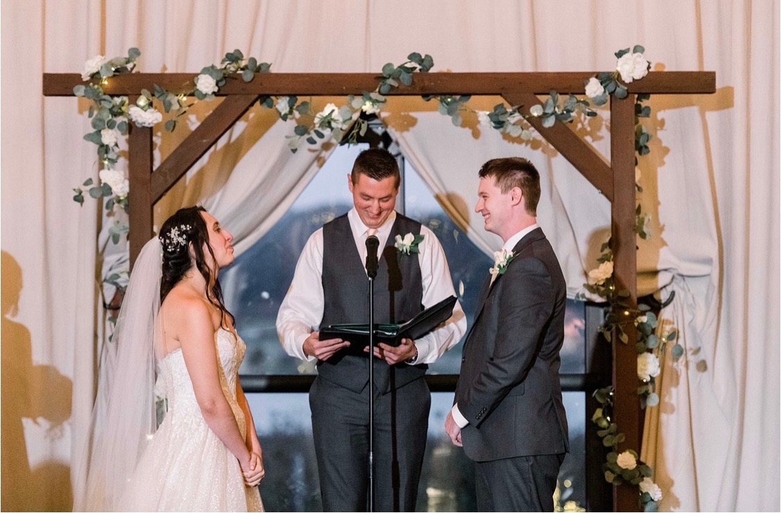 Dylan officiating a couple's wedding ceremony