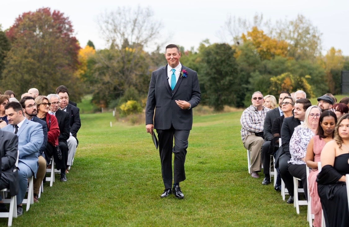 Dylan walking down the aisle before a ceremony