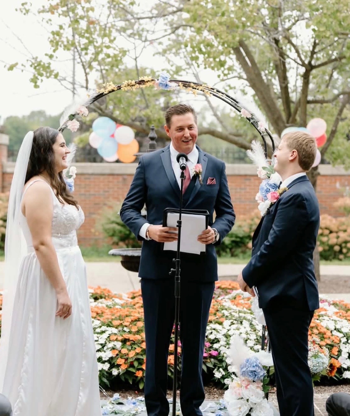 Dylan officiating an intimate garden wedding