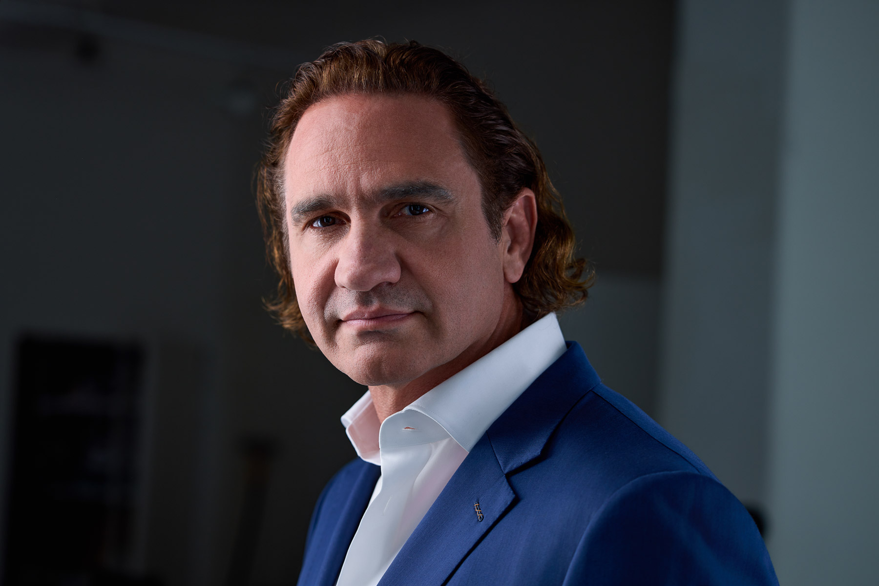 Juan Grobler, Founder and CEO of Global Footprints, in a blue suit