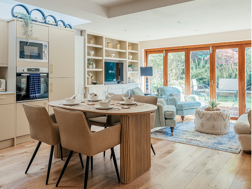 Open-plan kitchen and dining room with garden doors at Gayville Road, Battersea