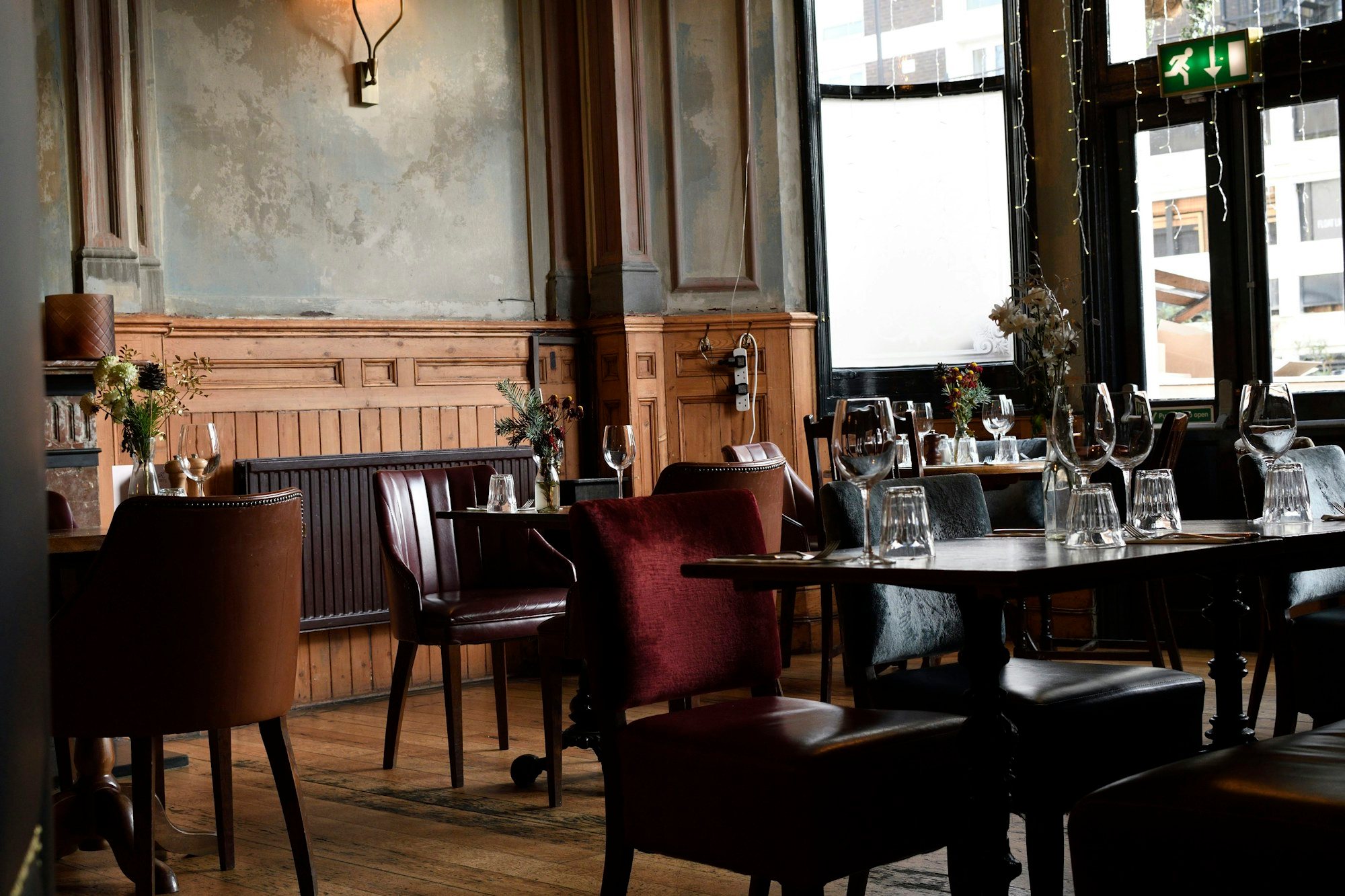 A restaurant dining room with set tables