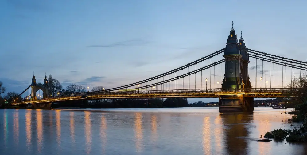 Hammersmith Bridge over the Thames at dusk