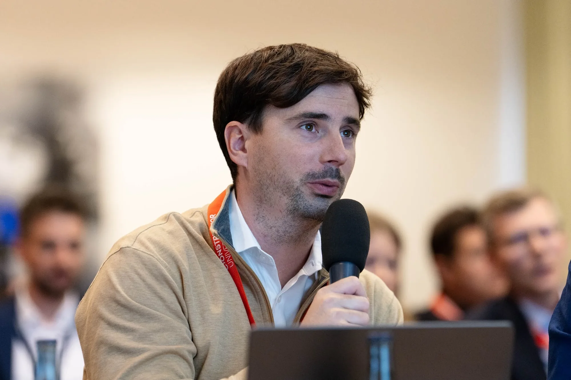 Dr. Valentino Jadriško speaking into a microphone as a jury member at Constructor Start Demo Day 2026
