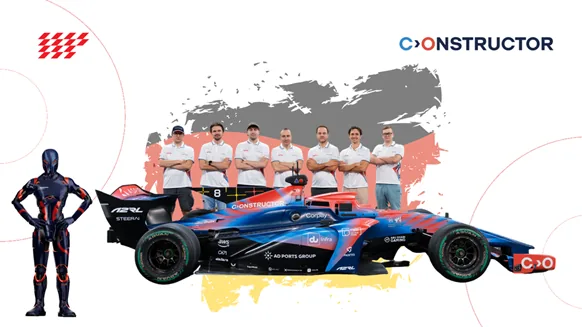 The Constructor racing team behind the Constructor A2RL race car, next to the A2RL robot driver figure