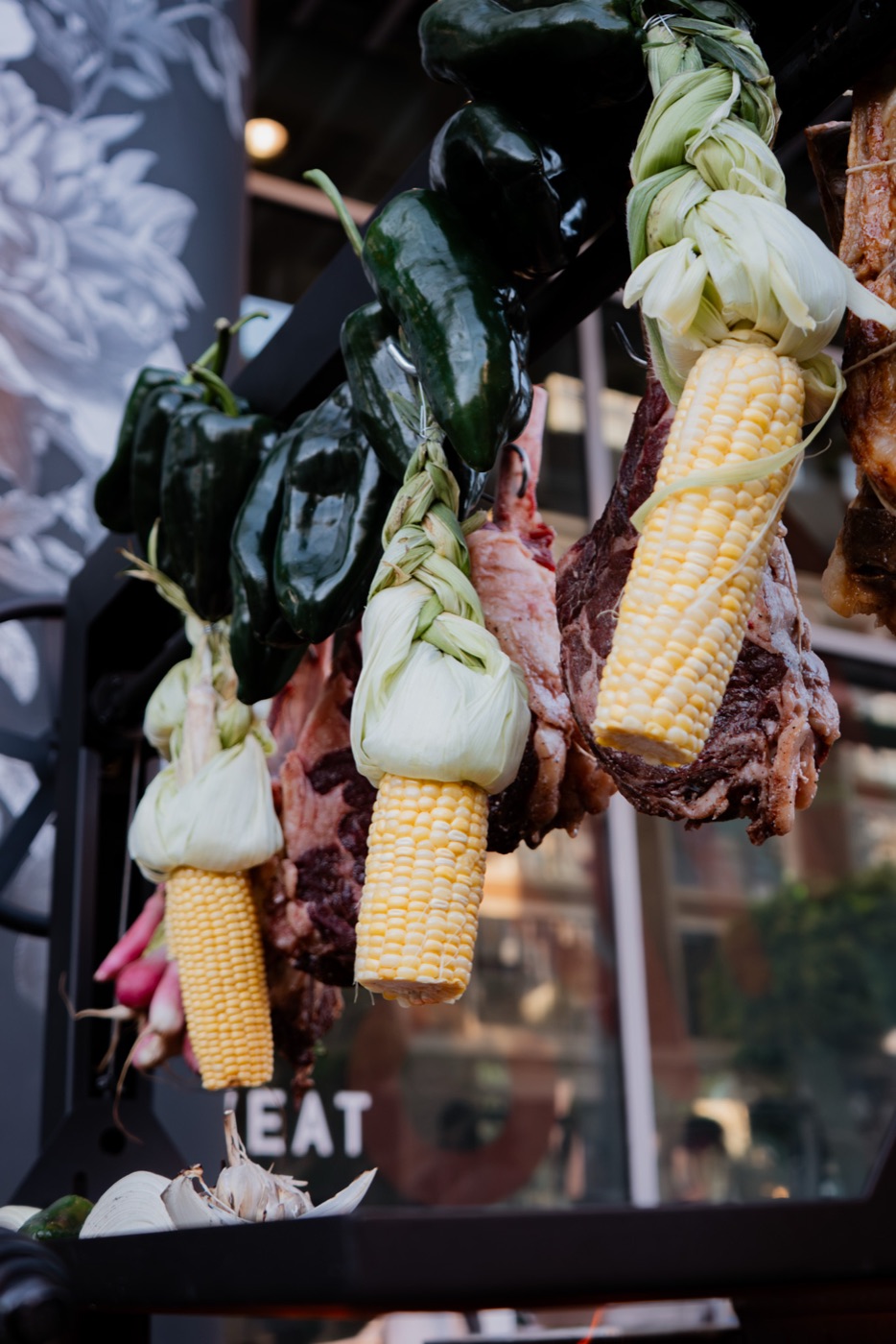 Corn, garlic and chiles hanging by the fire