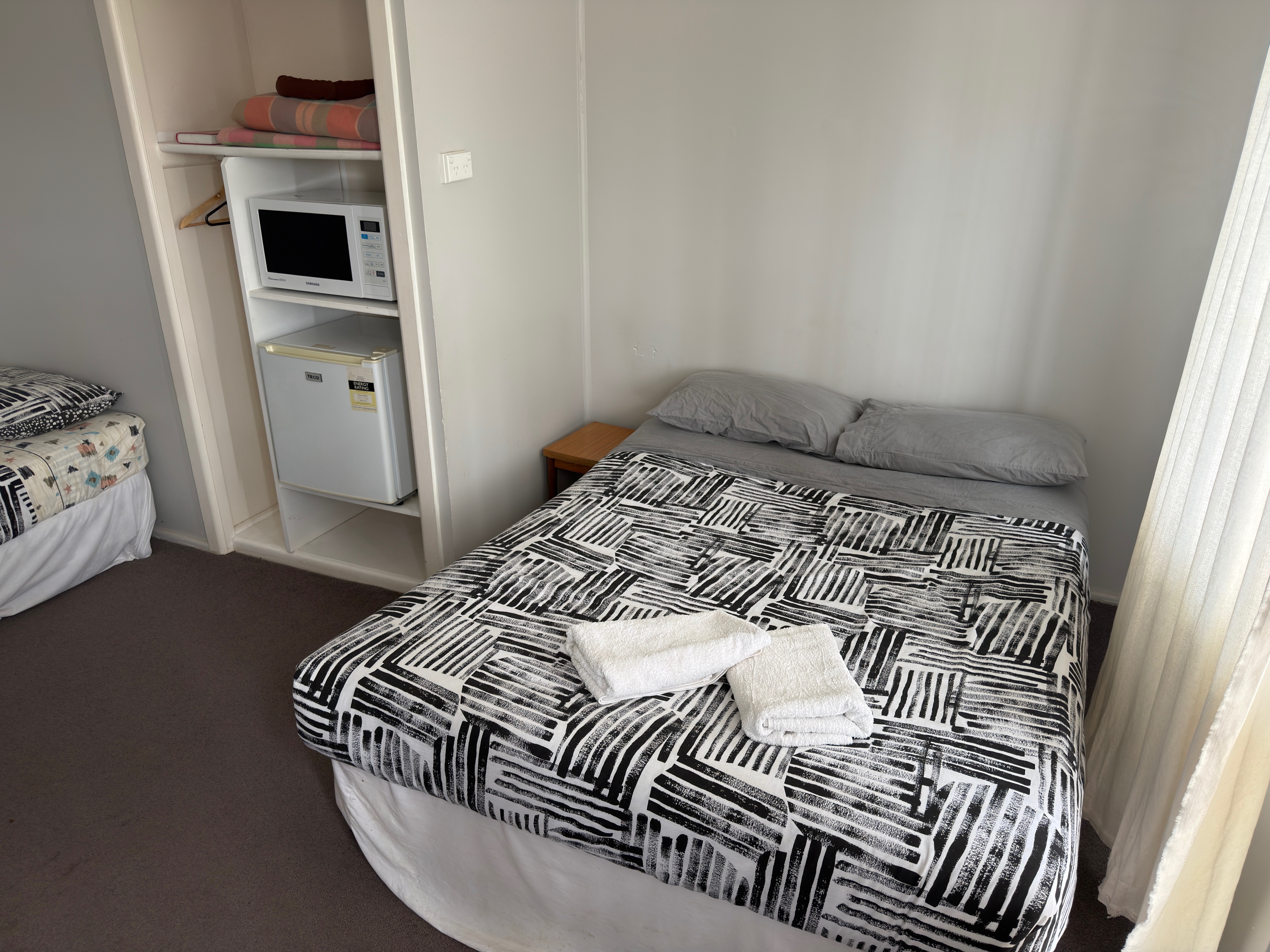 Self-contained apartment lounge and kitchenette