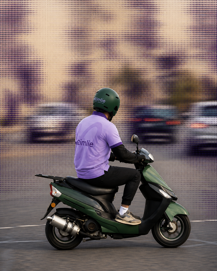 Nimlie team member riding a scooter to install the POS at the shop