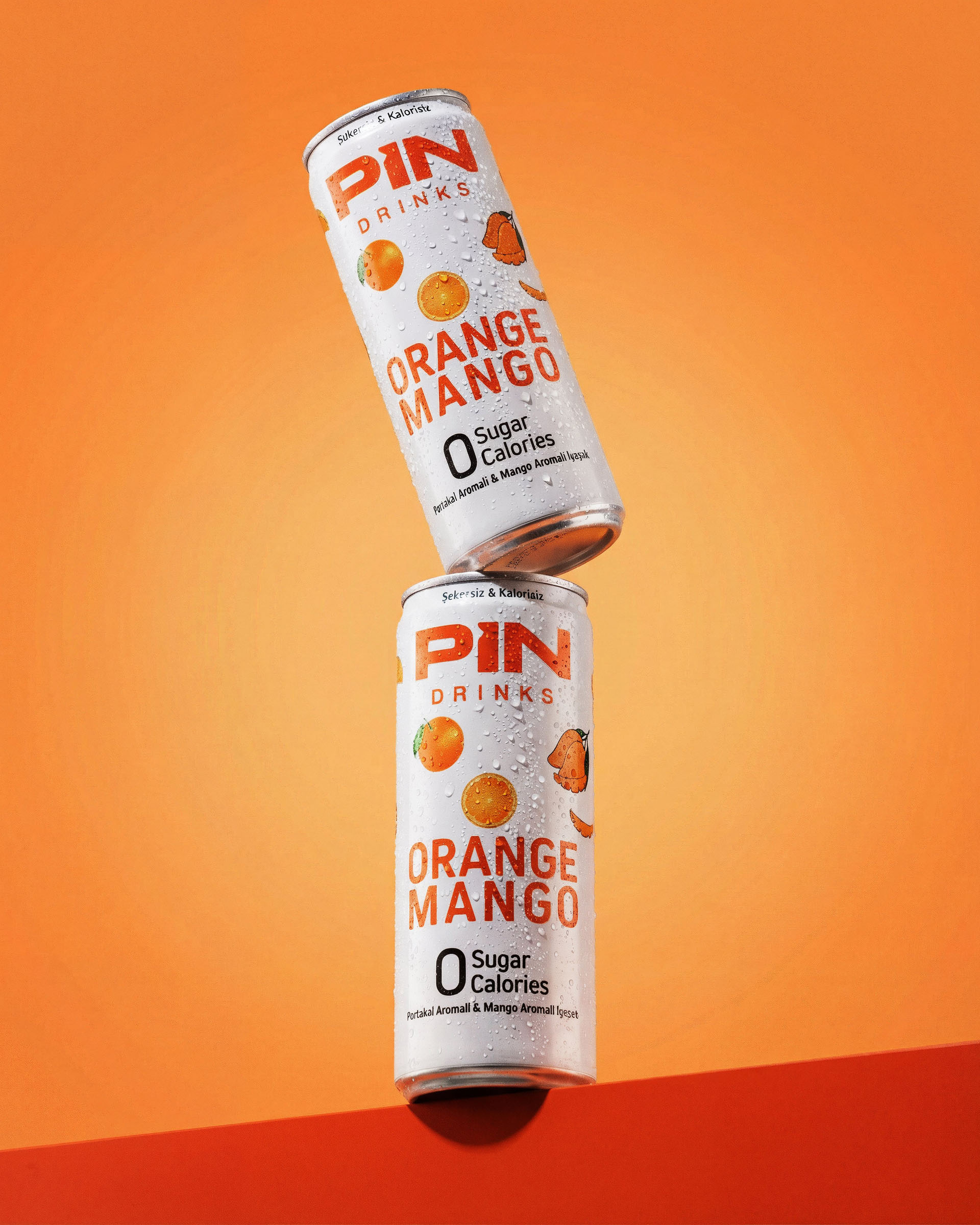 Pin orange mango stacked cans, beverage visual by 35milimetre
