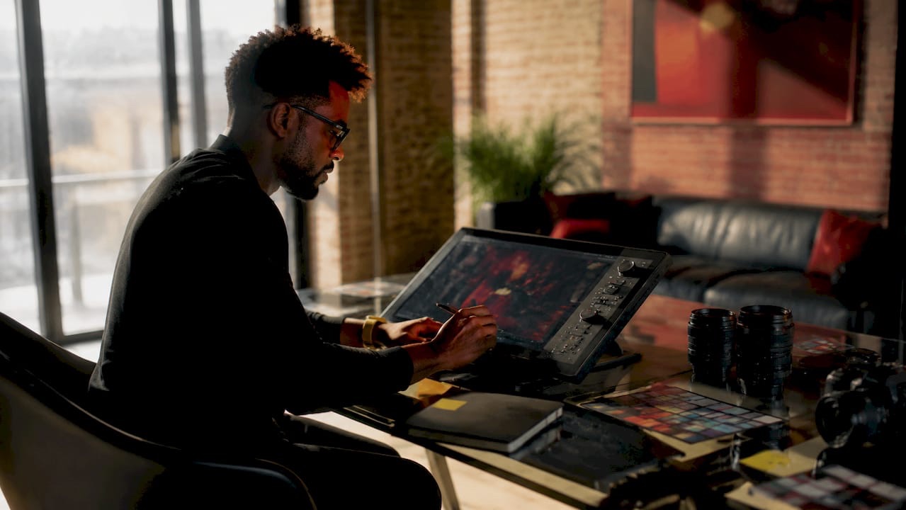 Hands adjusting AI enhancement settings on tablet