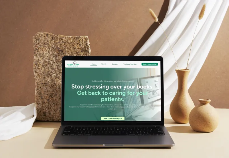 Maple Tree Bookkeeping homepage on a laptop