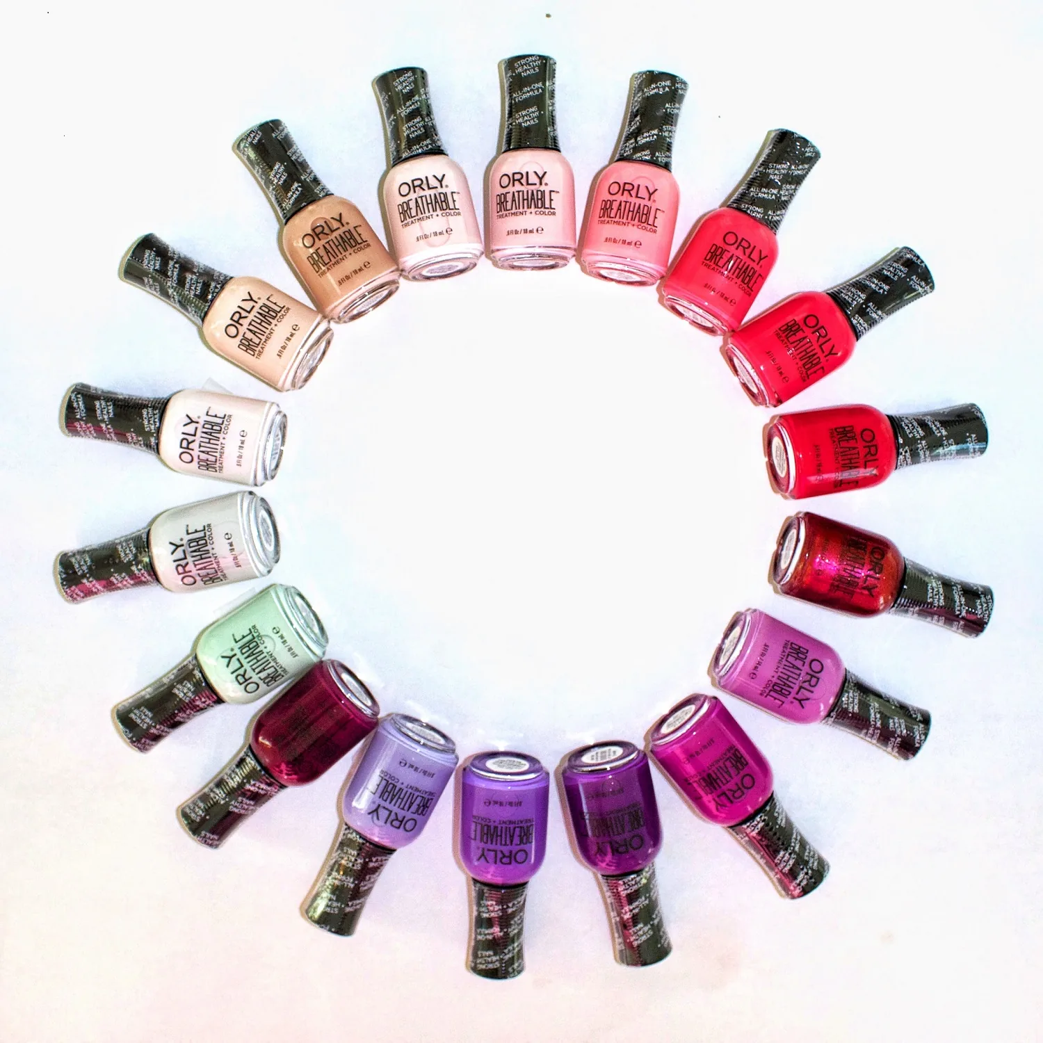 Orly Breathable nail polish bottles arranged in a color-wheel circle