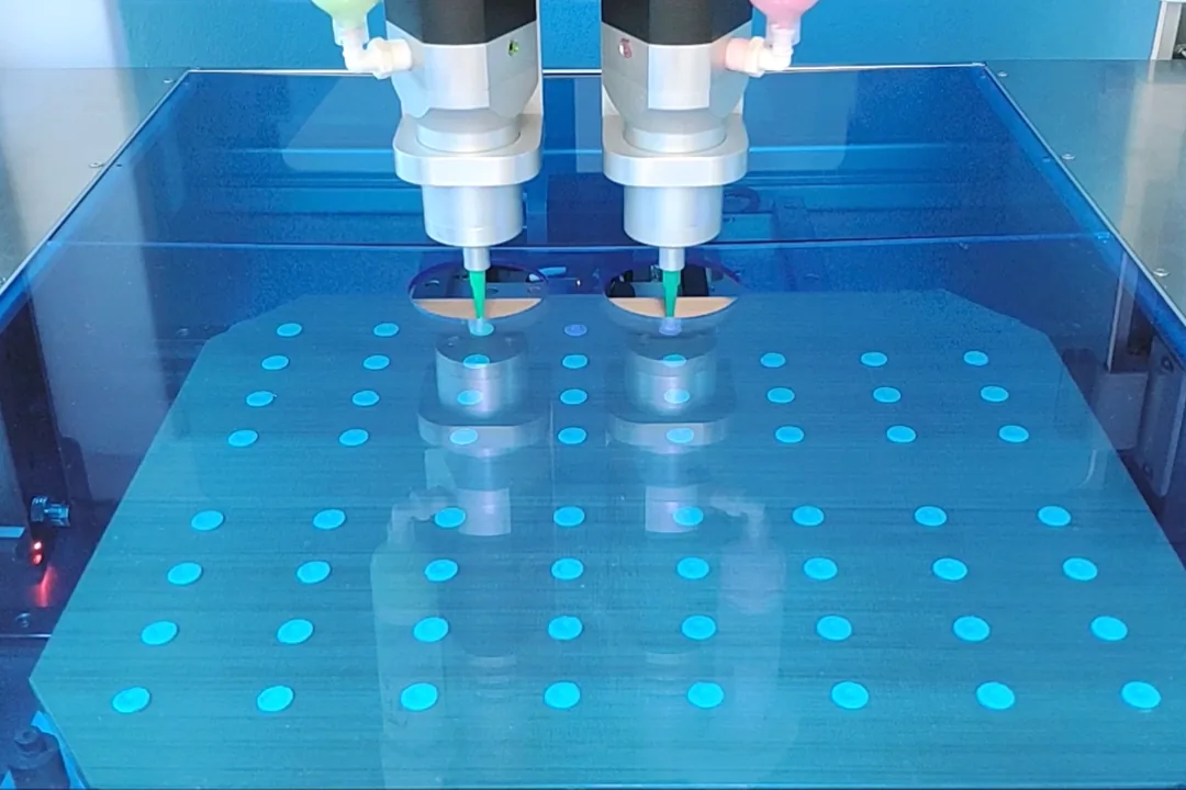 CraftMake printheads printing a tray of doses