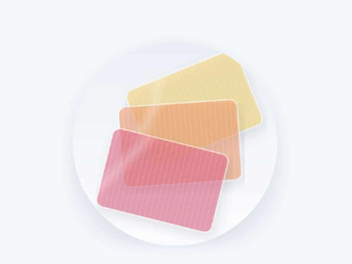 3D-printed oral dissolvable films in pink, orange and yellow