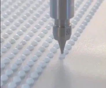 A print head depositing mini-tablets
