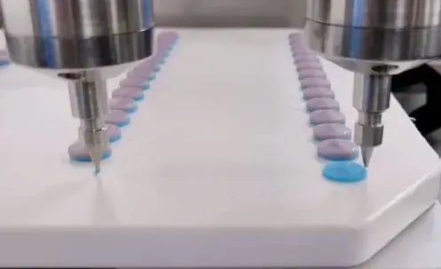 Two print heads printing dual-print tablets