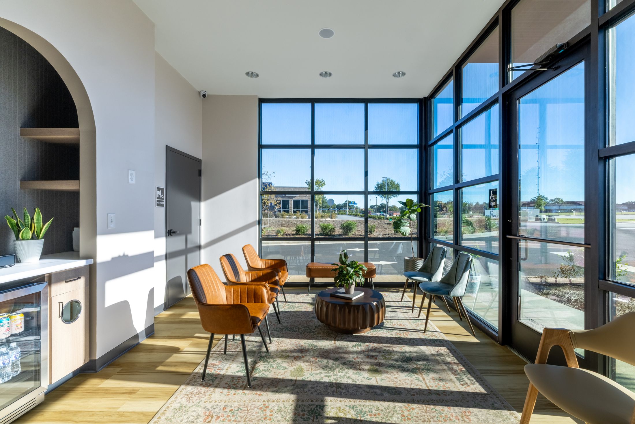 Bright, modern lobby with floor-to-ceiling windows at White Rose Dentistry in York, SC