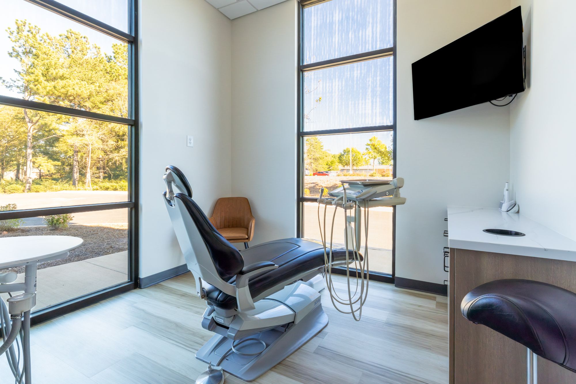 Bright private treatment room with a window view at White Rose Dentistry
