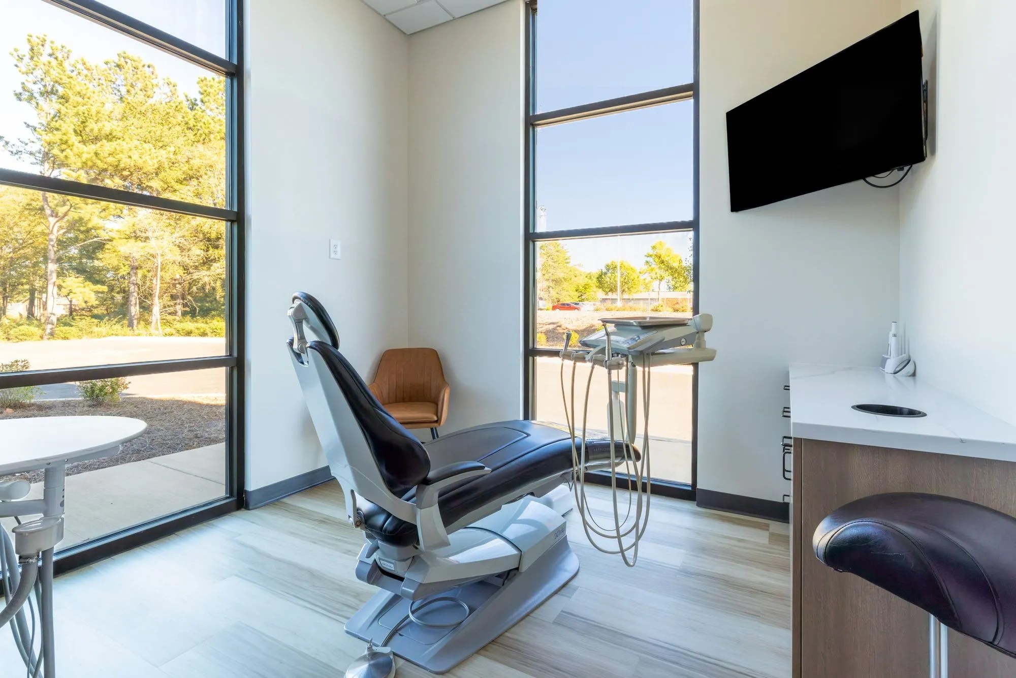Bright private treatment room with a window view at White Rose Dentistry