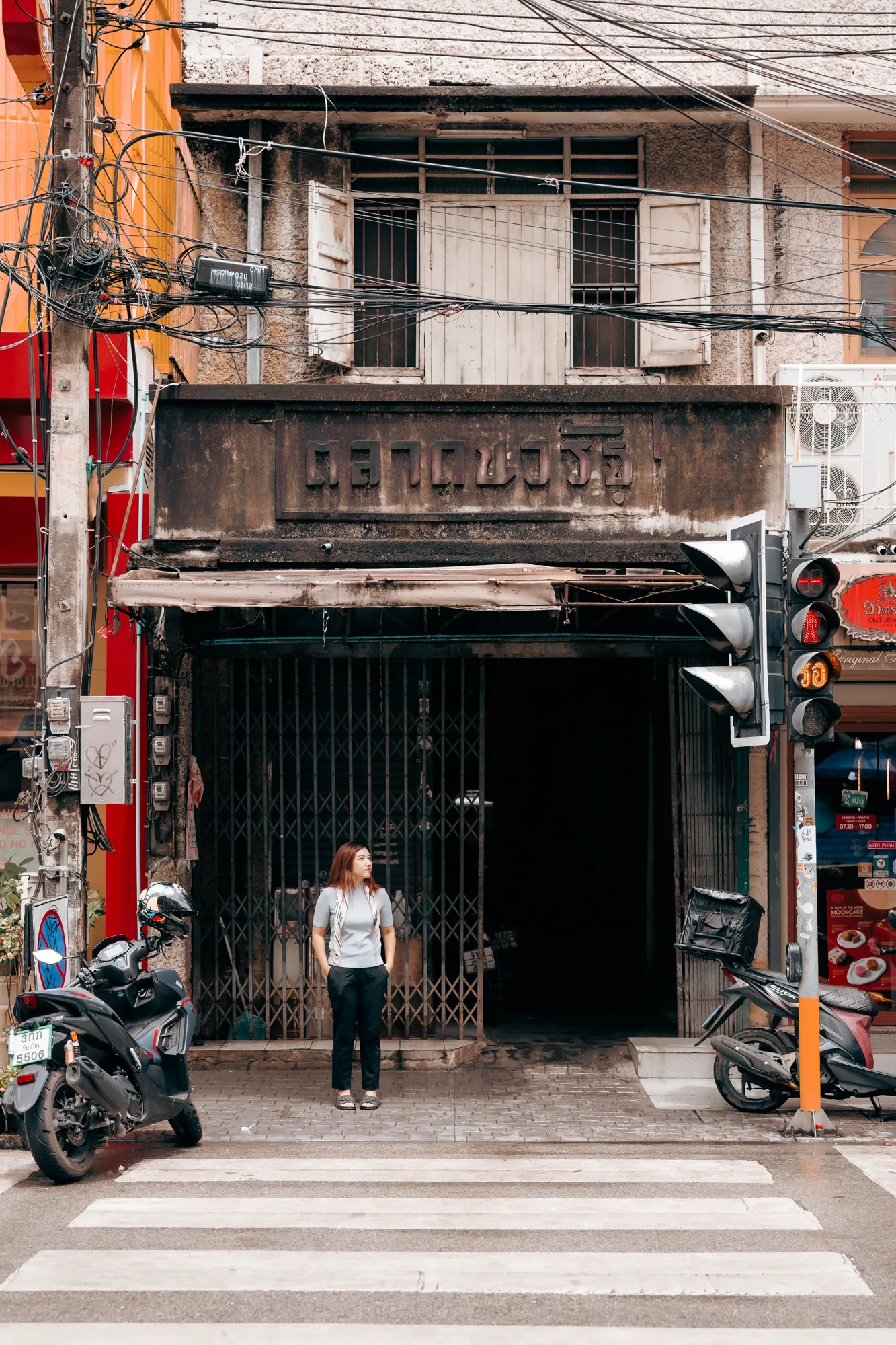 Aom in front of an old Chiang Mai shophouse