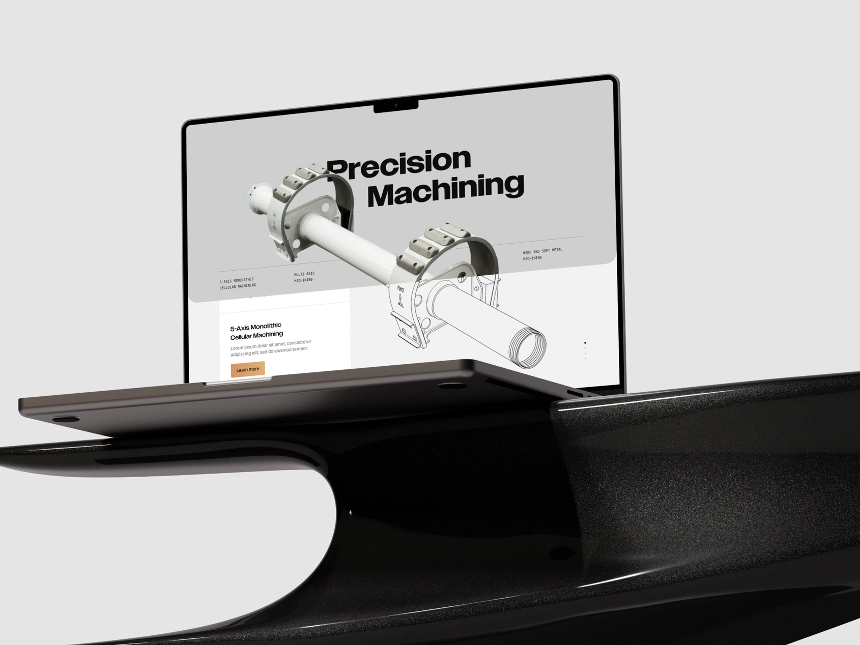 The Precision Machining page on a laptop resting on a carbon wing