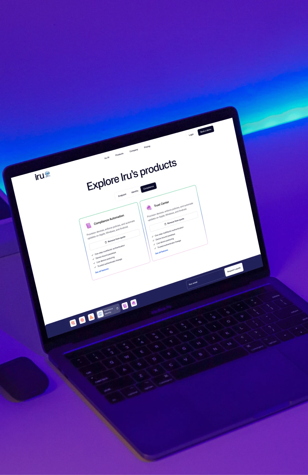 A laptop in violet light showing Explore Iru's products