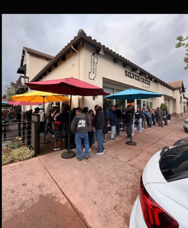 Line of guests outside a restaurant on opening day
