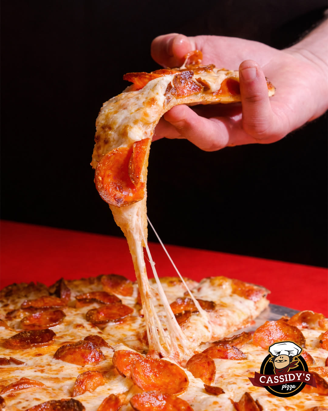 Pepperoni pizza slice with a cheese pull
