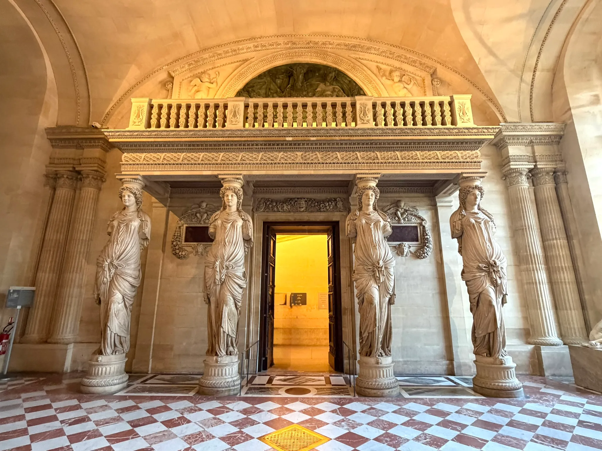 Jean Goujon's four caryatids supporting the musicians' tribune in the Louvre's Salle des Cariatides