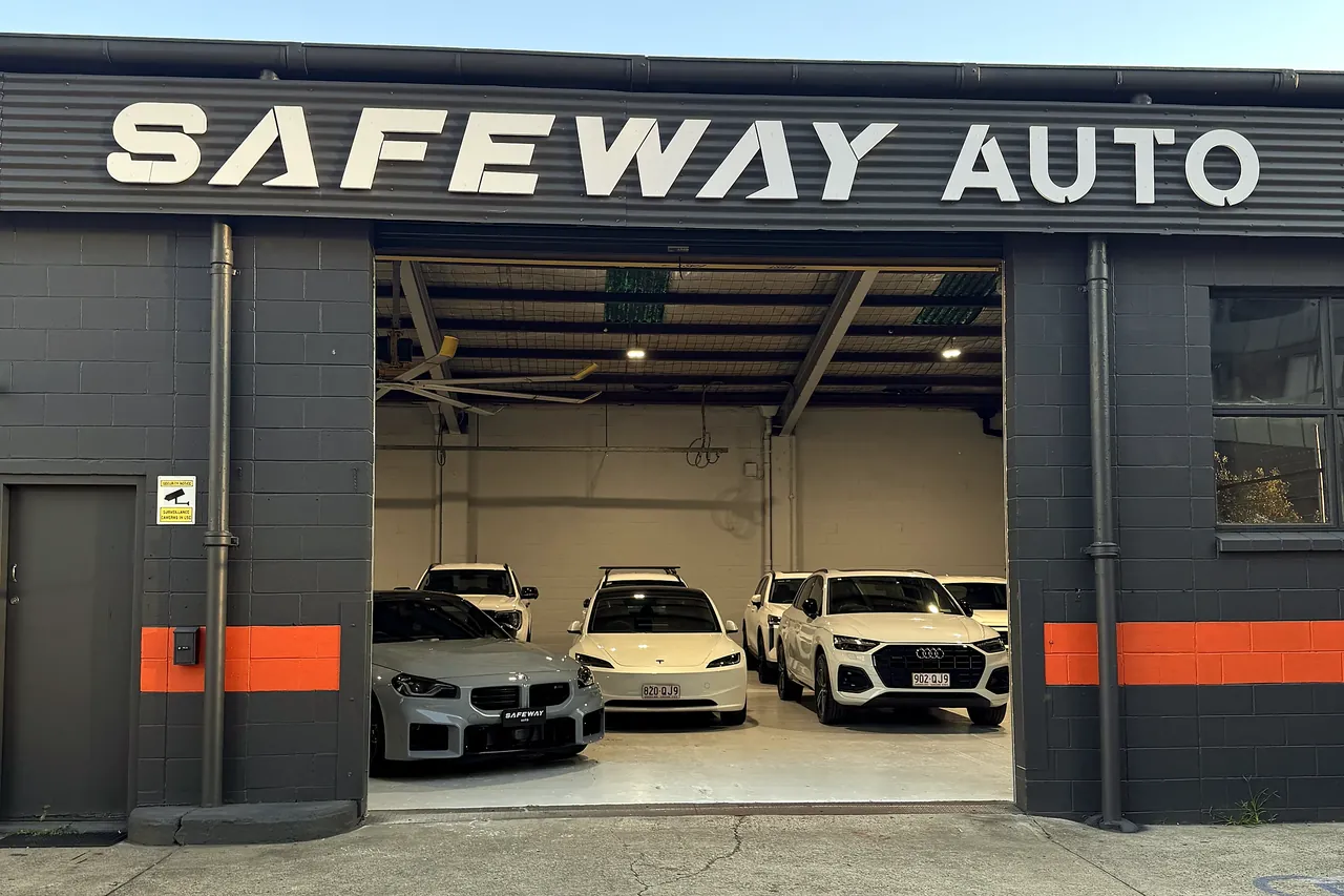 The Safeway Auto showroom at 4 Ferry Road, West End, Brisbane, with its roller door open and vehicles on display